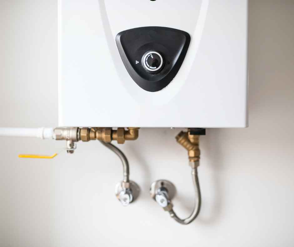 Part of a tankless water heater on the wall of a home